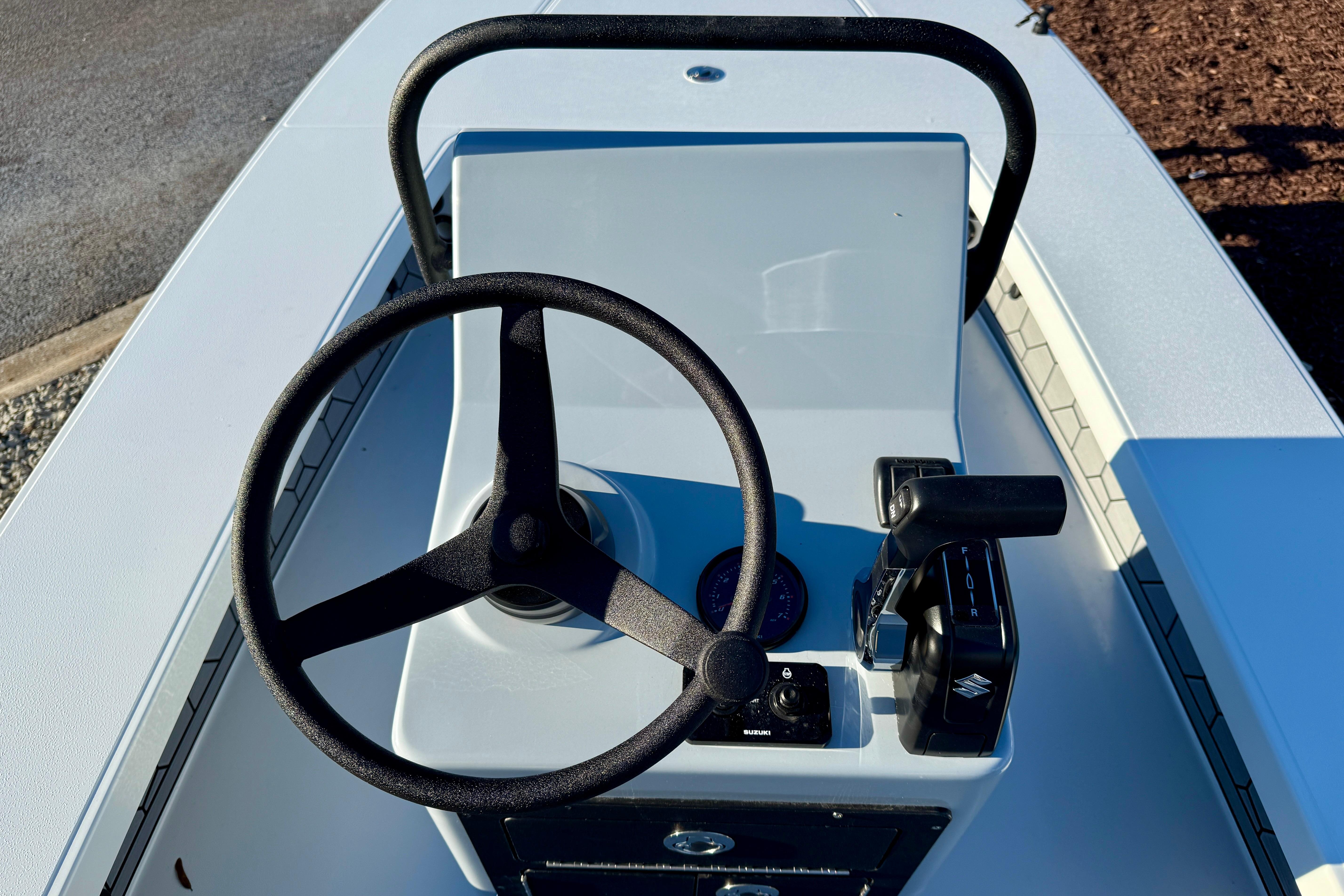 2026 East Cape EVO 17V boat console with steering wheel and controls.