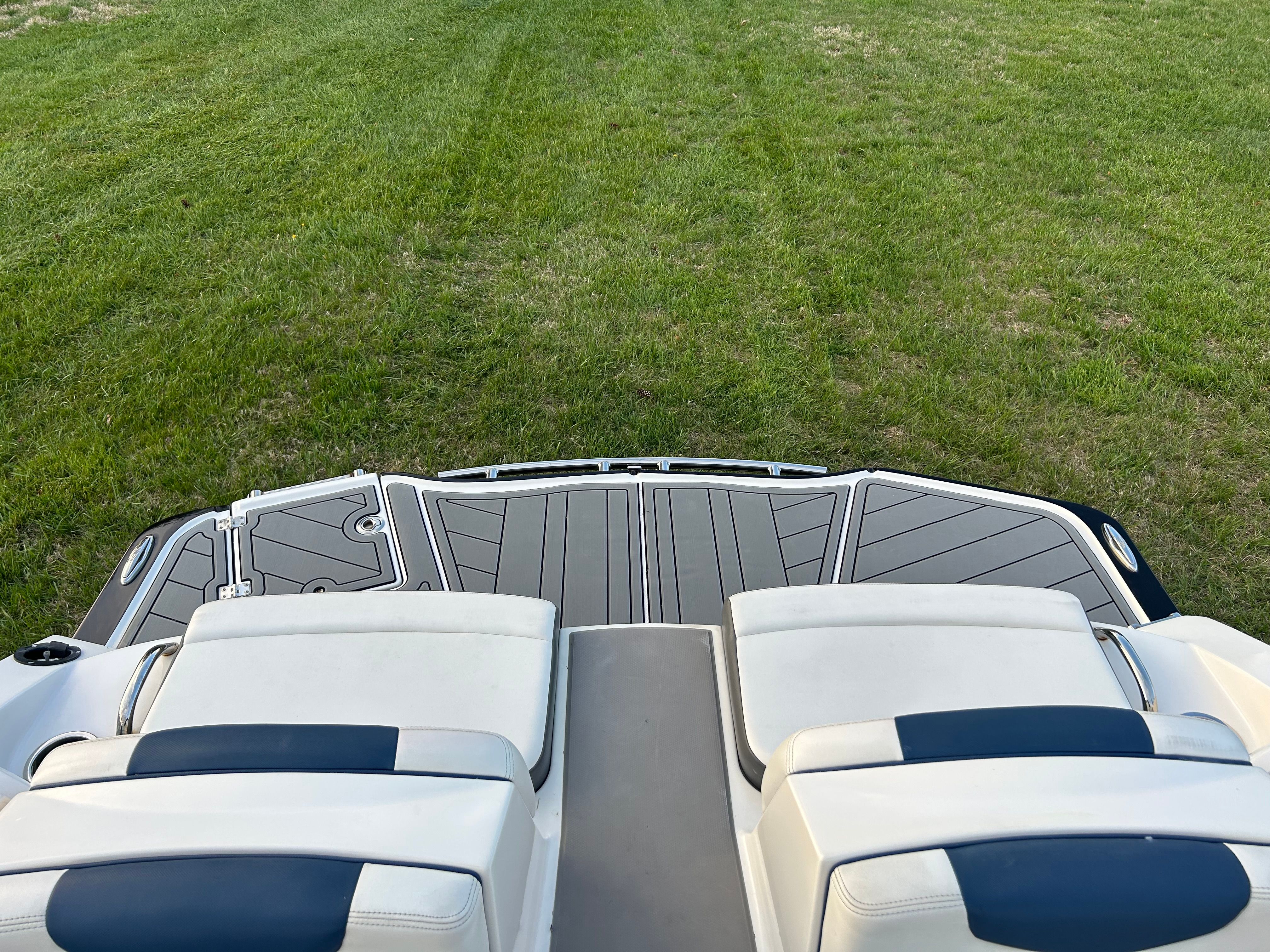 Rear view of 2015 Chaparral Vortex 243 VRX on grass.