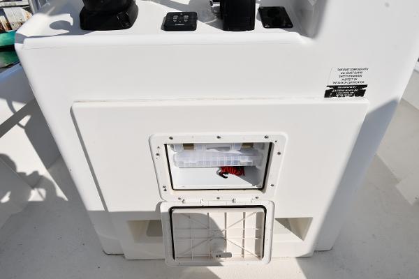 2021 Eastern 248 Center Console boat storage compartment and control panel.