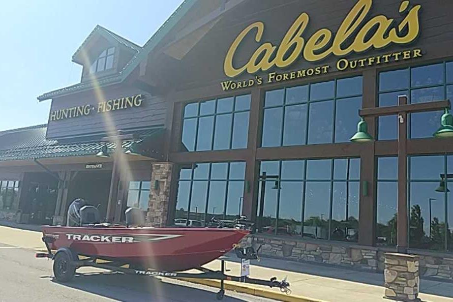 2026 Tracker Super Guide V-16 T boat outside Cabela's store.