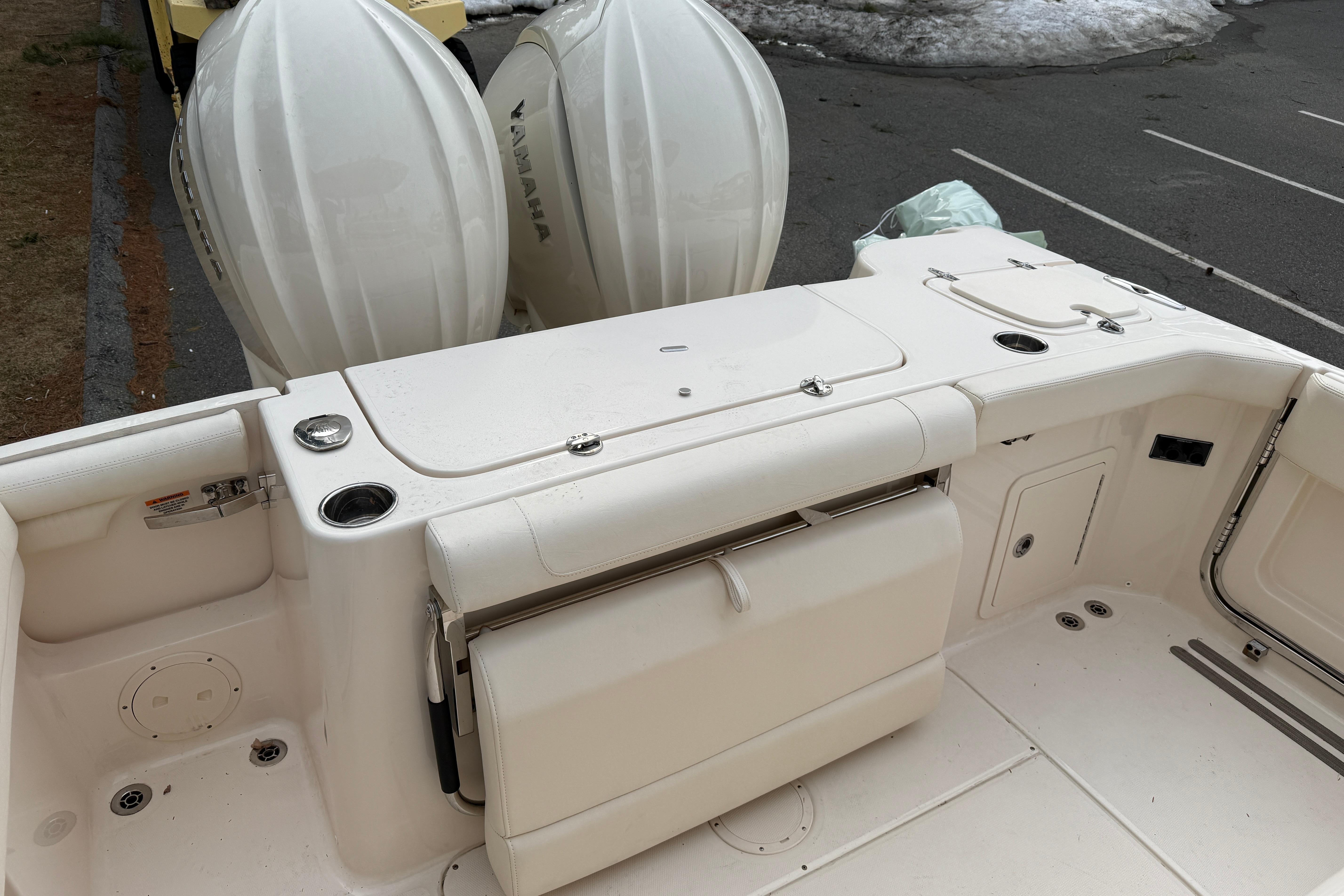 2024 Grady-White Canyon 271 boat deck with dual Yamaha outboard engines.