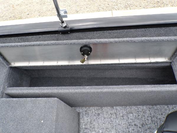 2025 Tracker Pro Guide V-175 Combo boat storage compartment with carpeted interior.