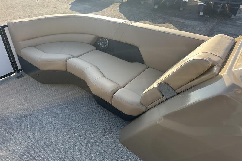 Luxurious seating on 2026 Evotti 523CS boat, featuring beige upholstery and modern design.