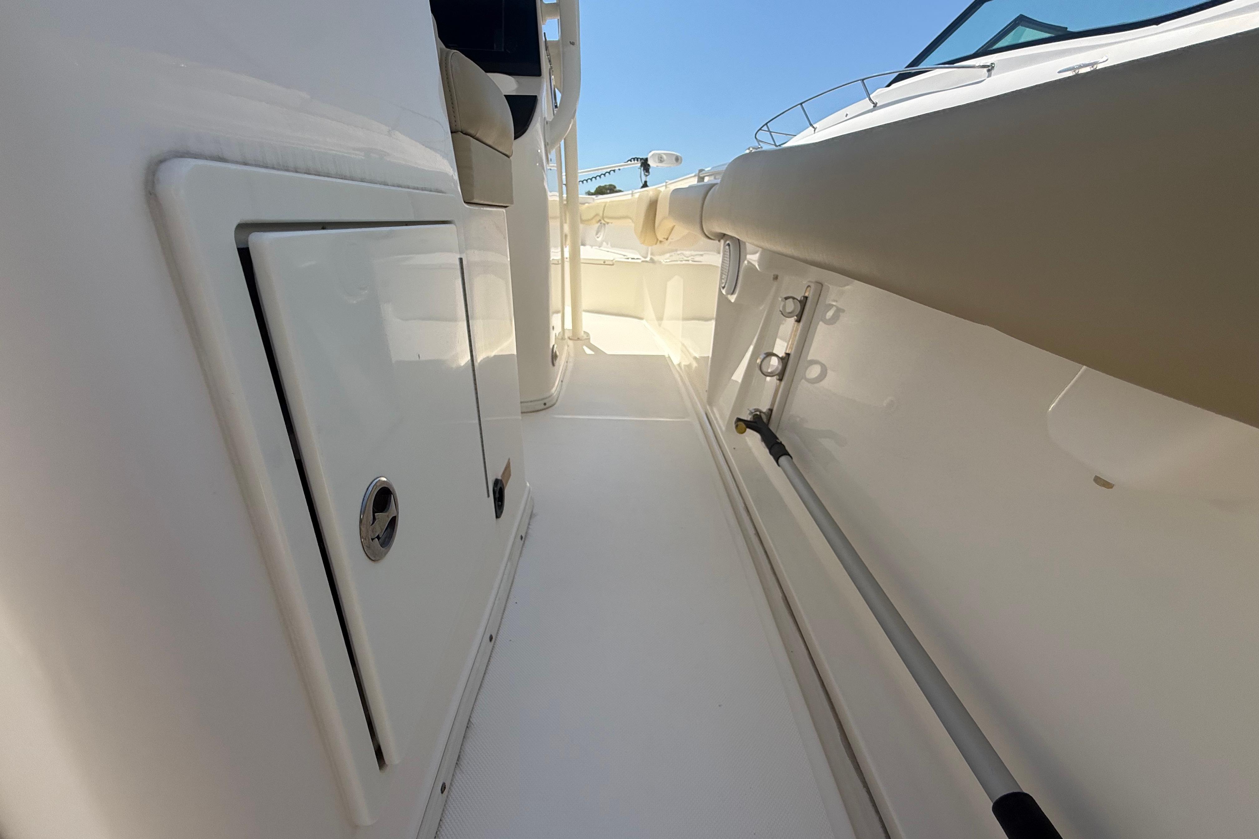 2019 Key West Billistic 281 Center Console boat interior, featuring sleek white surfaces and storage compartments.