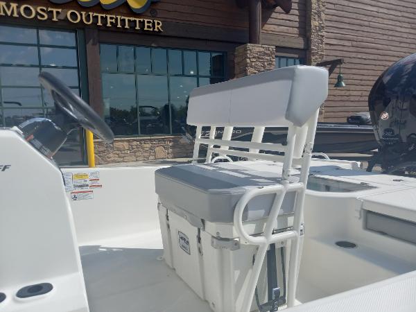 2024 Mako Pro Skiff 19 CC boat interior with seating and steering wheel.