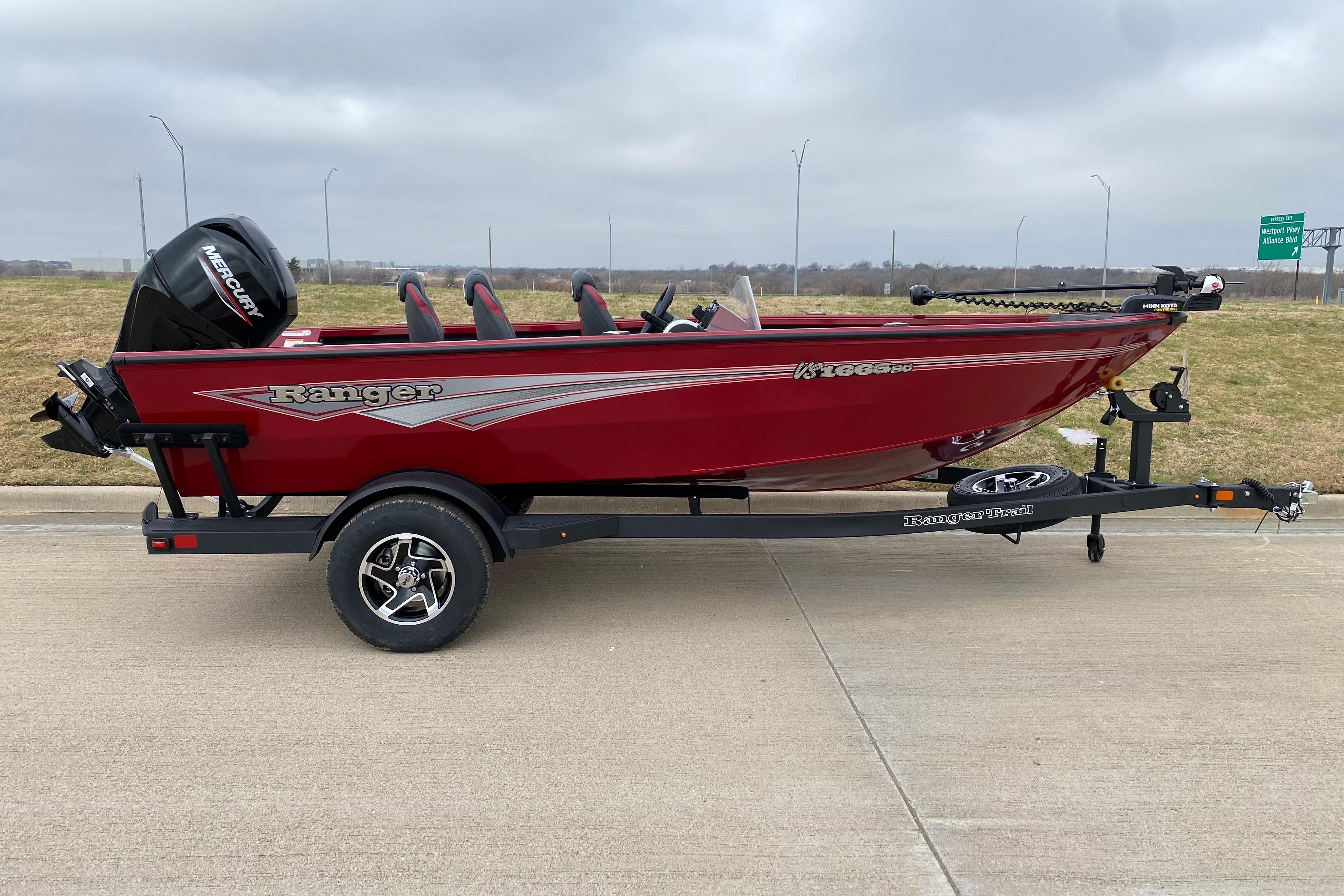 2026 Ranger VS1665SC red fishing boat on trailer, featuring Mercury outboard motor.
