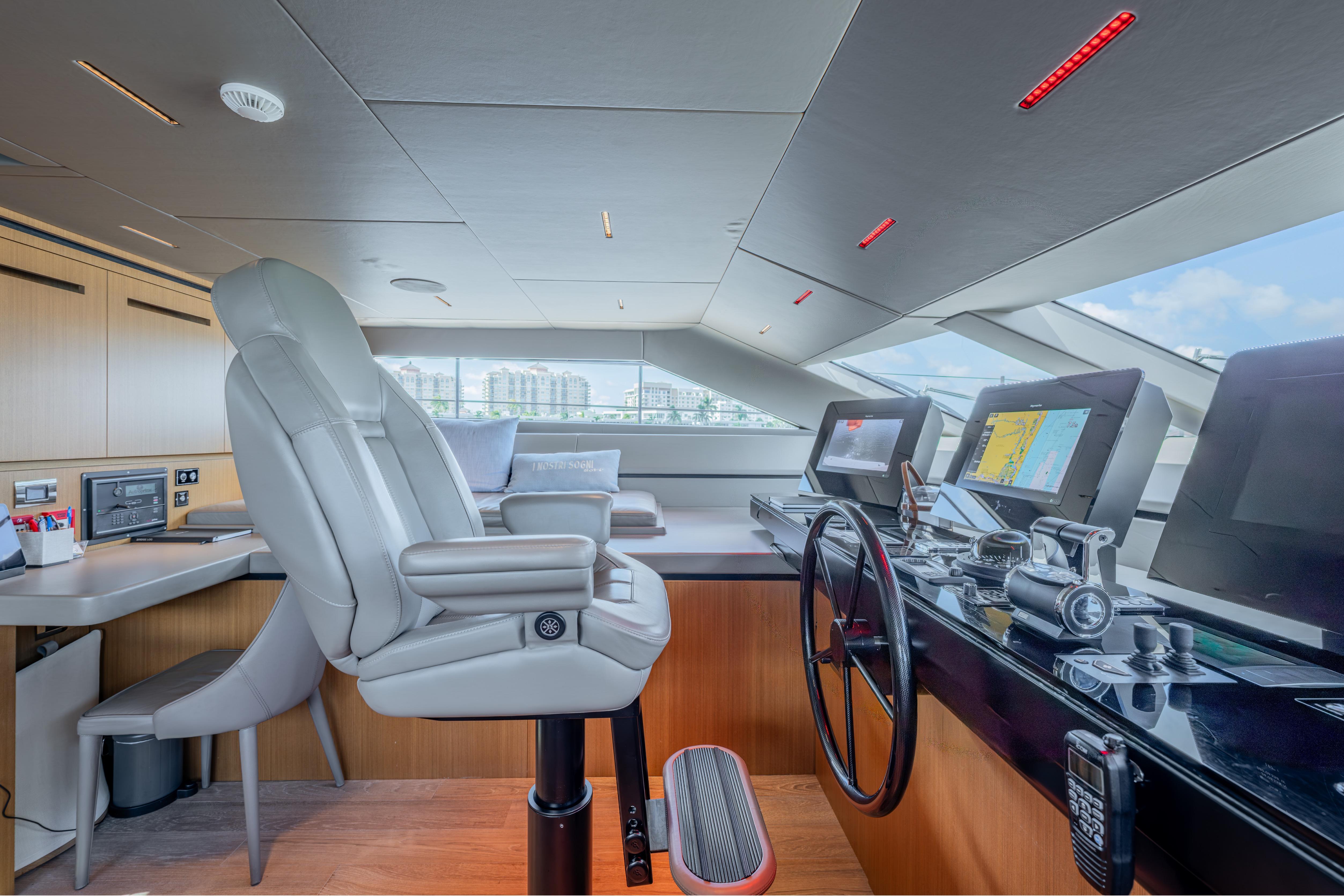 Modern helm station of 2023 Sanlorenzo SL120A yacht with advanced navigation systems.