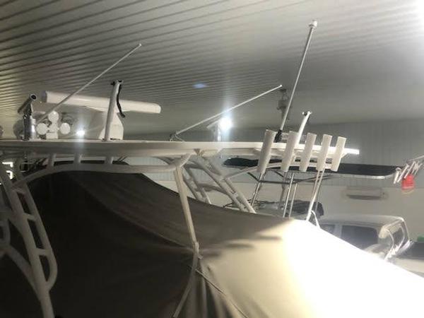 2019 Midnight Express 39 Cuddy boat stored indoors, covered and equipped with antennas.