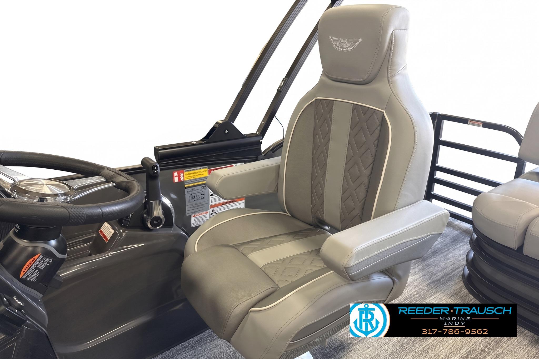 Captain's chair and steering wheel of 2027 Bennington 22 MSB pontoon boat.