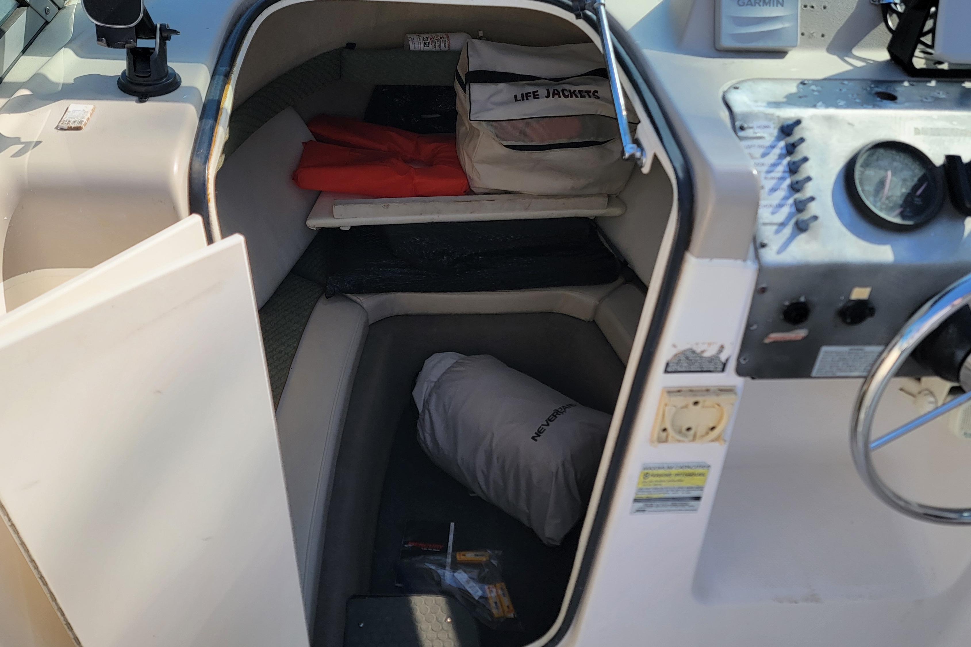 2003 Trophy 2002 Walkaround cabin with life jackets and boating equipment.