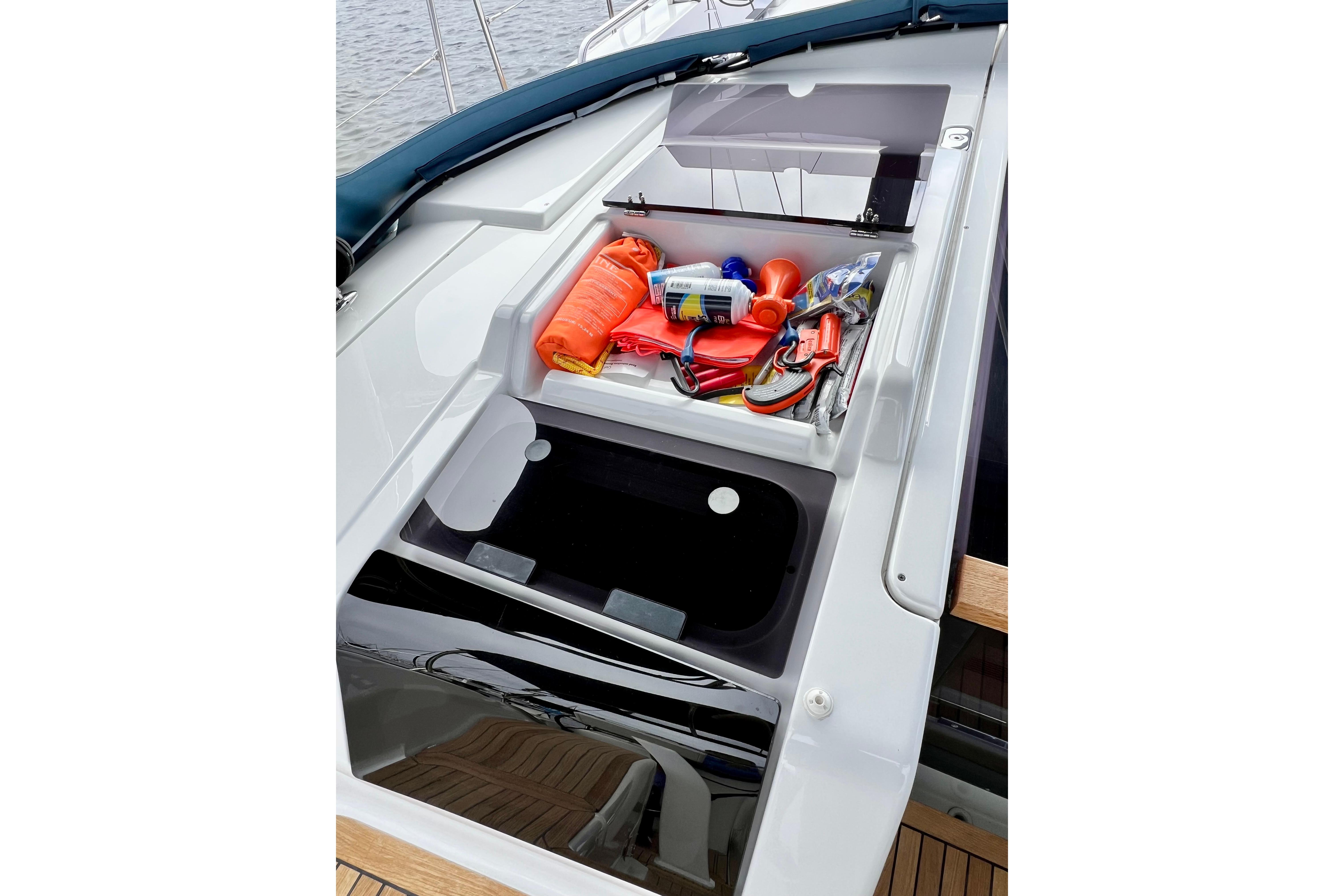 Storage compartment on 2016 Hanse 455 yacht, containing safety and maintenance equipment.