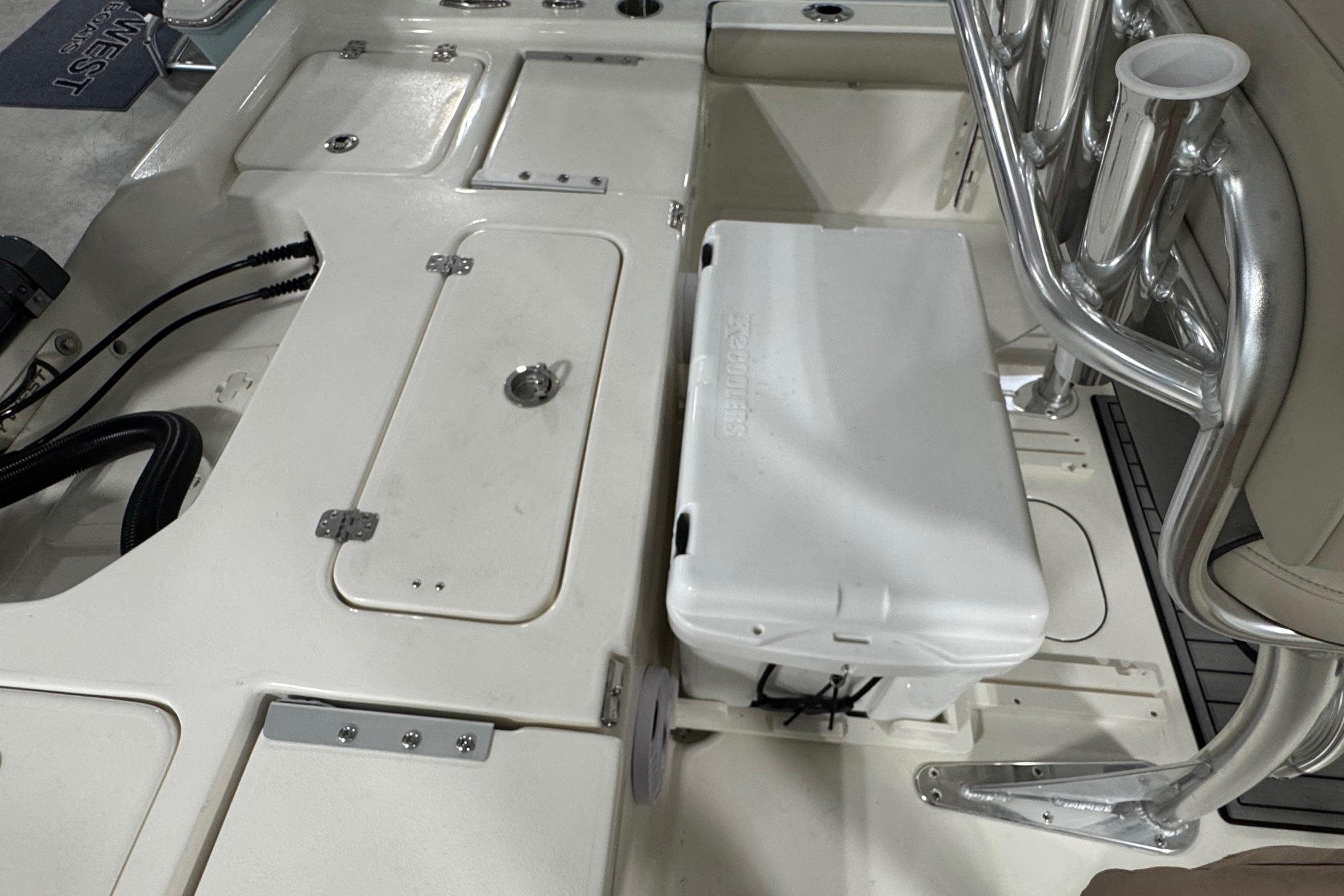 2026 Key West 210 Bay Reef boat interior with storage compartments and seating.