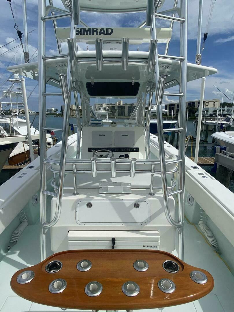 2012 Contender 39ST boat with Simrad equipment, docked at a marina.