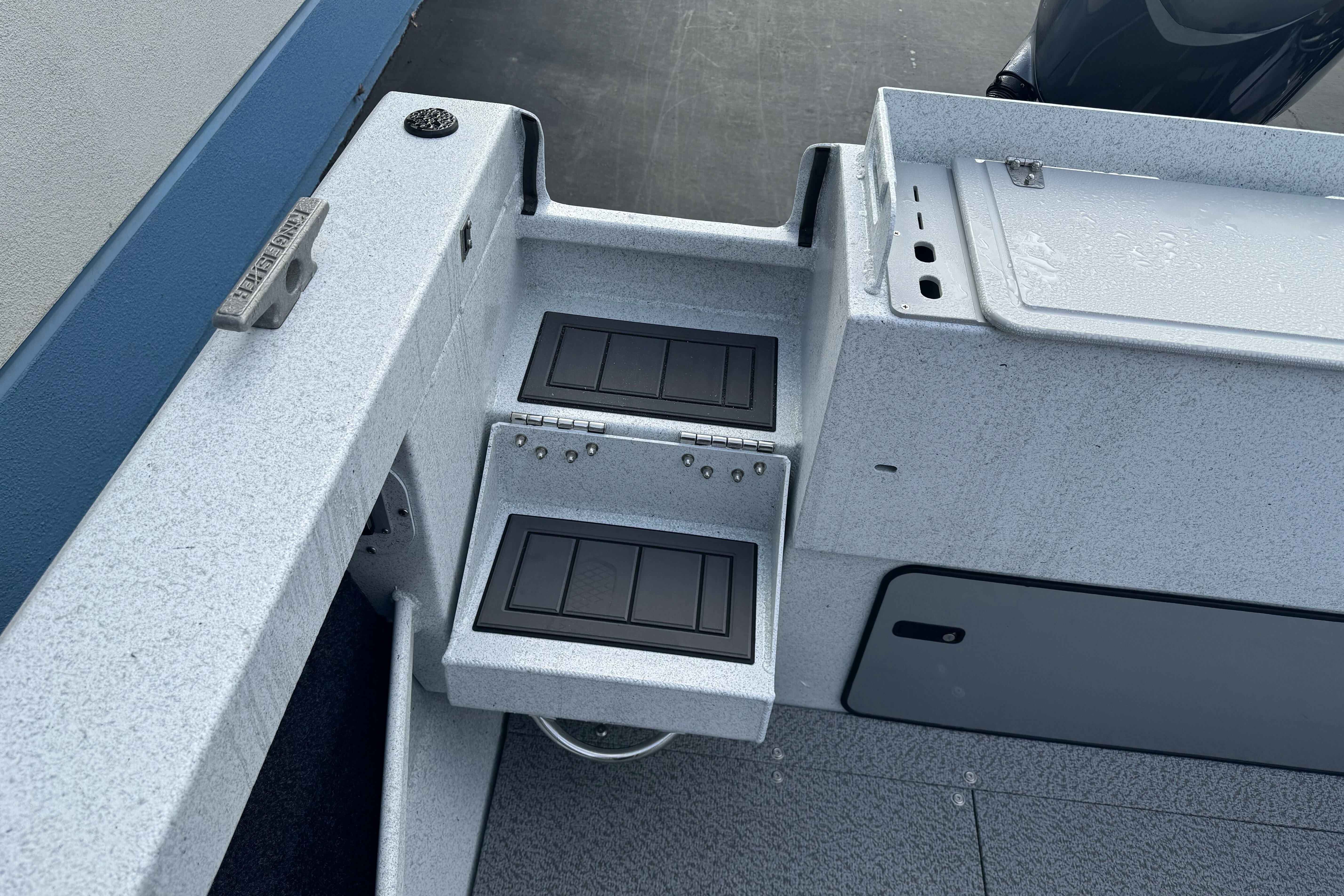 KingFisher 2025 Escape boat interior, featuring control panels and storage compartments.