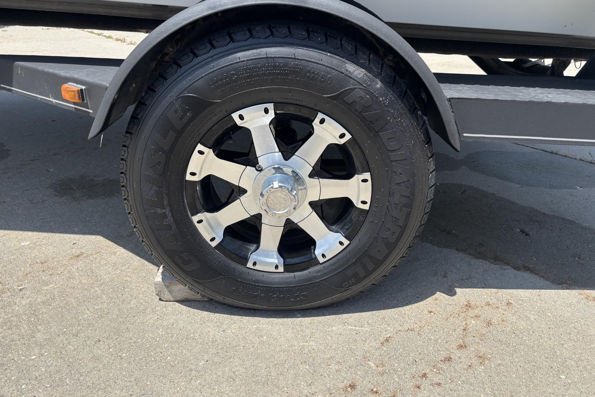 2017 Ranger RT178C trailer wheel with Carlisle radial tire on concrete surface.