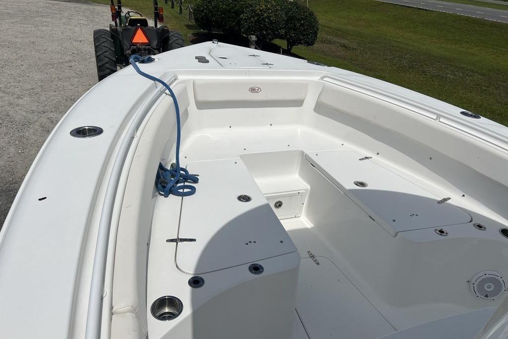 2021 Sea Hunt Gamefish 25 boat interior with seating and storage compartments.