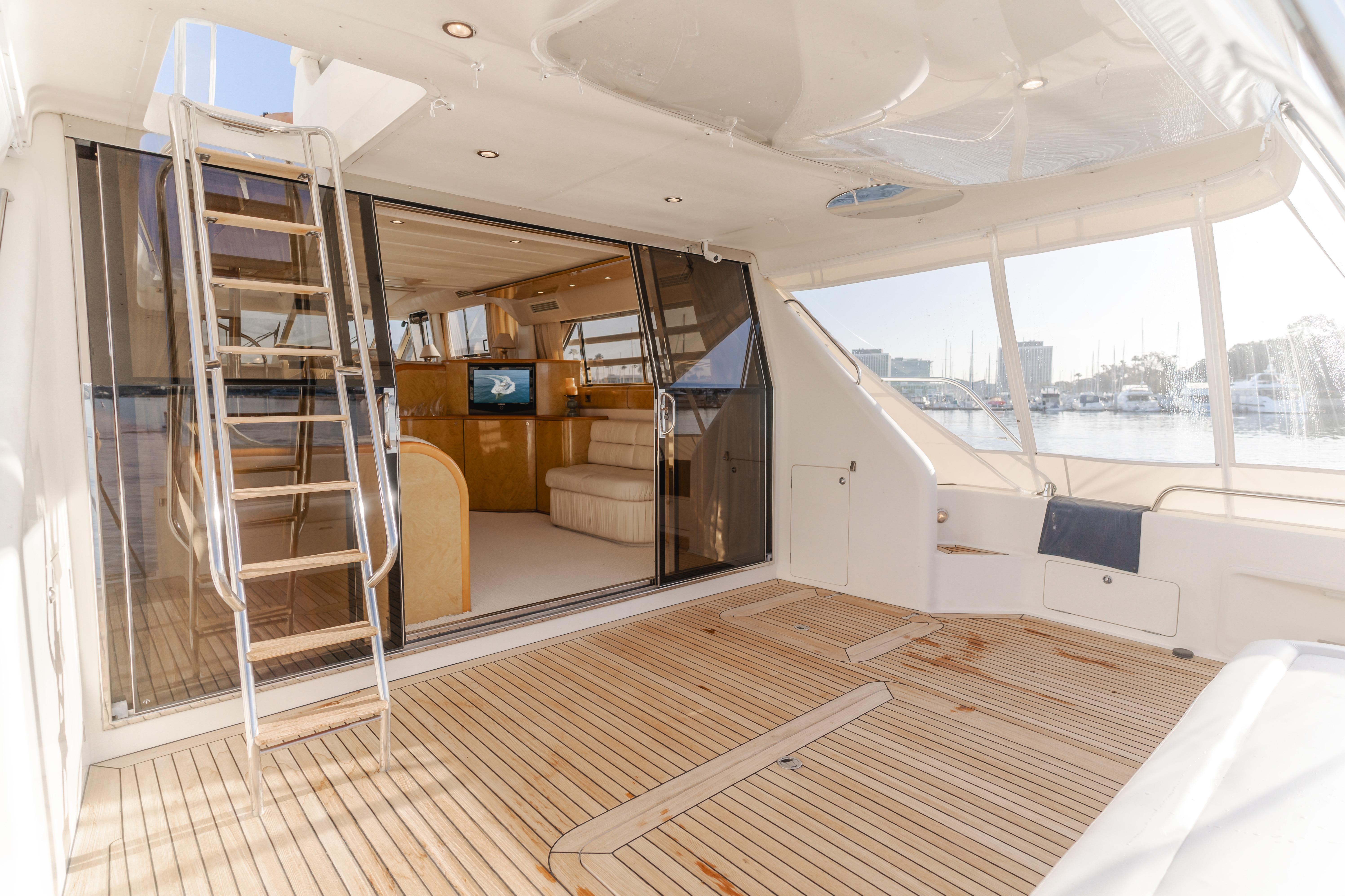 Luxurious 1997 Viking Sport Cruisers 66 Motor Yacht with spacious deck and elegant interior.