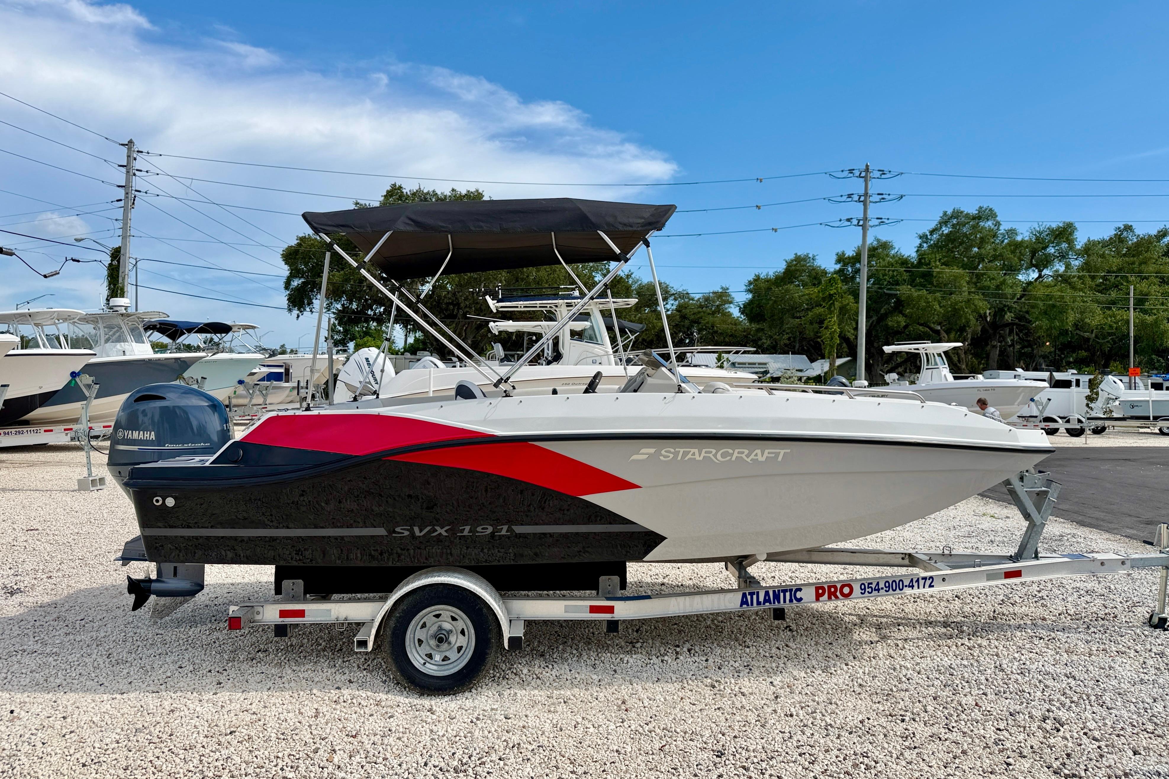 2021 Starcraft SVX 191 OB boat on trailer, featuring Yamaha outboard motor.