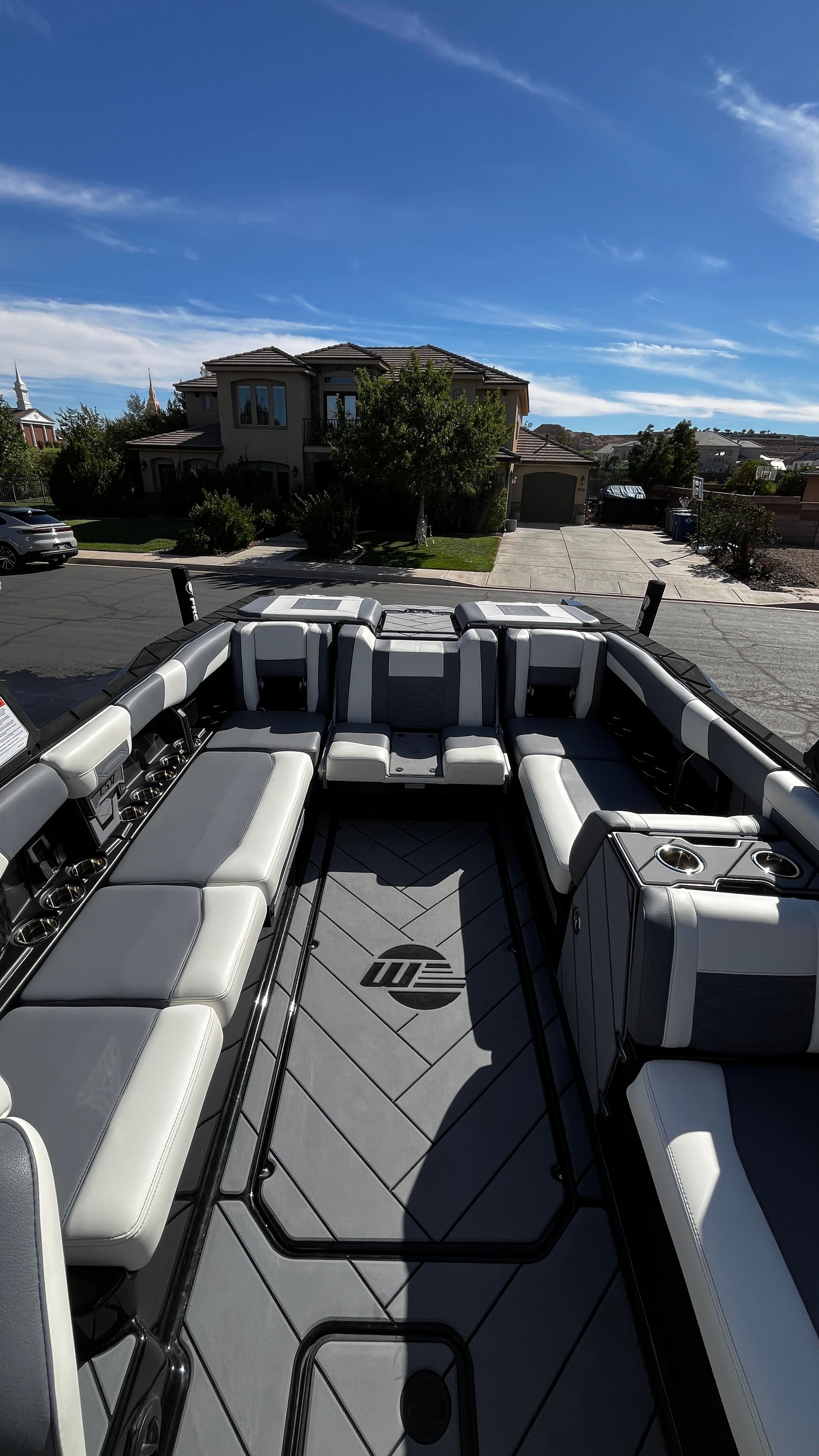 Interior view of a Malibu Wakesetter 26 LSV with gray and white seating.