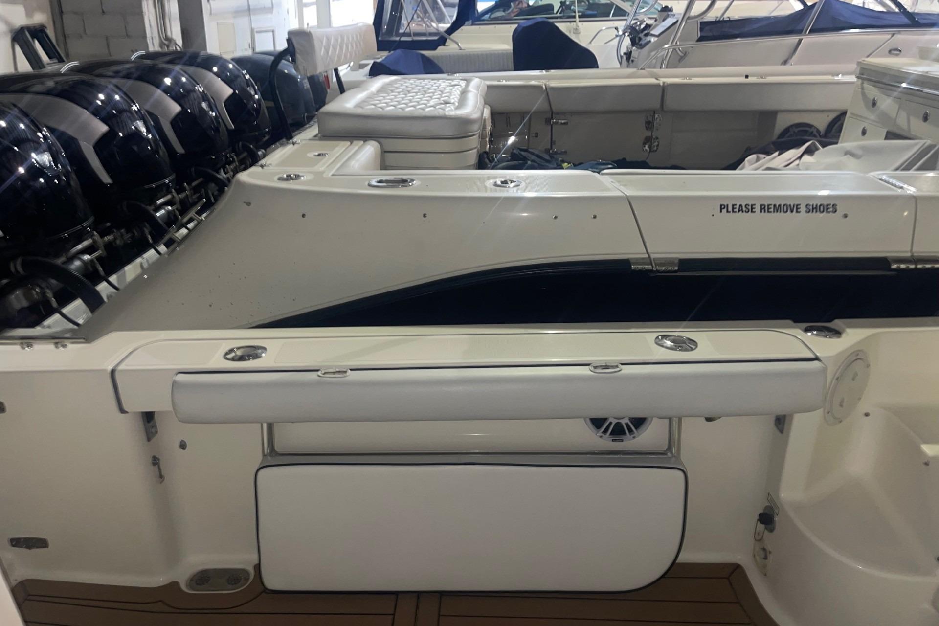 2000 Pursuit 3070 Offshore Center Console boat interior with multiple outboard engines.