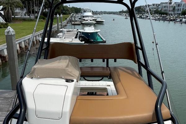 2020 Scout 420 LXF boat docked in a scenic marina.