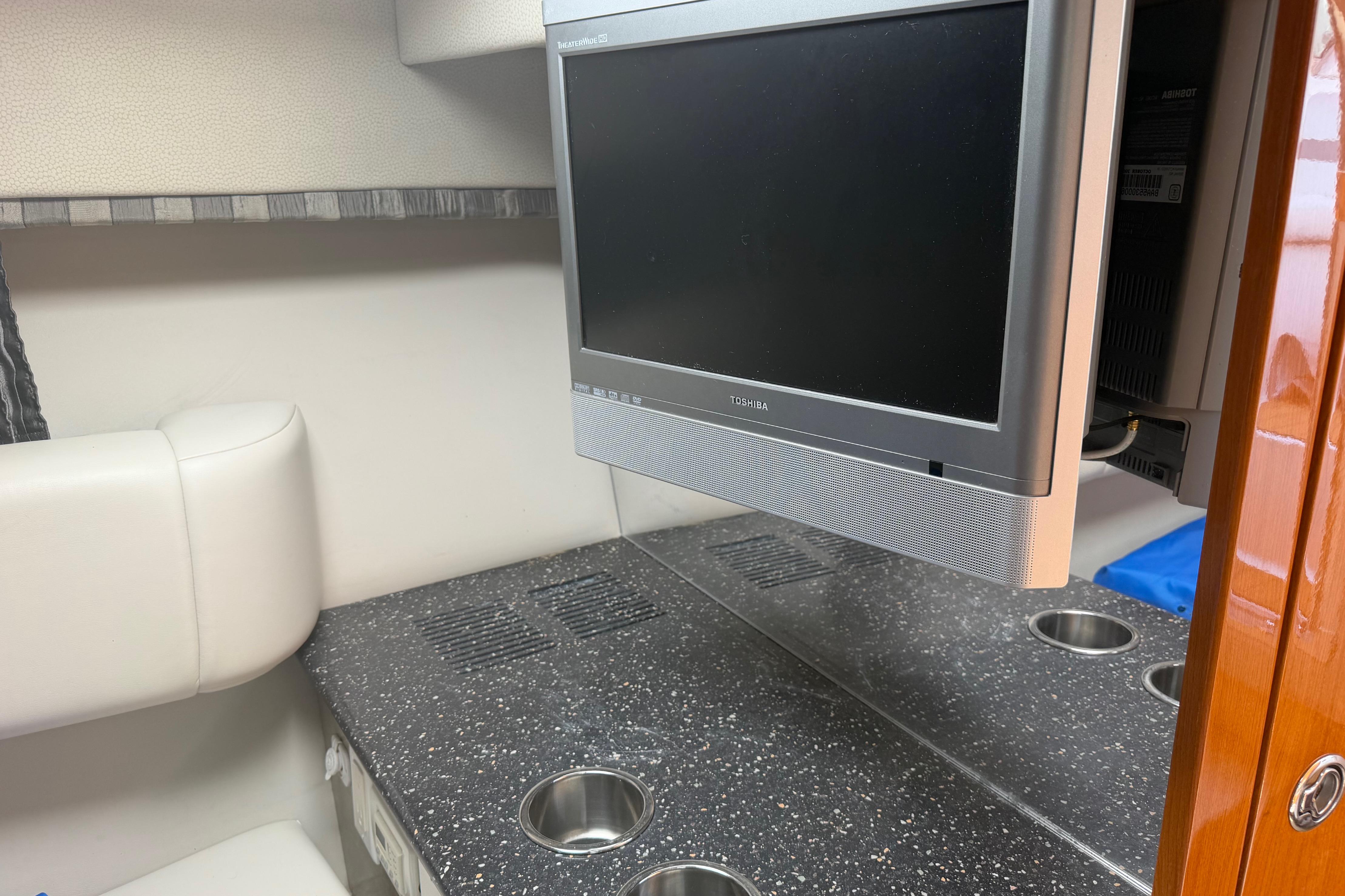 Interior of 2006 Formula 330 Sun Sport with TV and sleek countertop design.