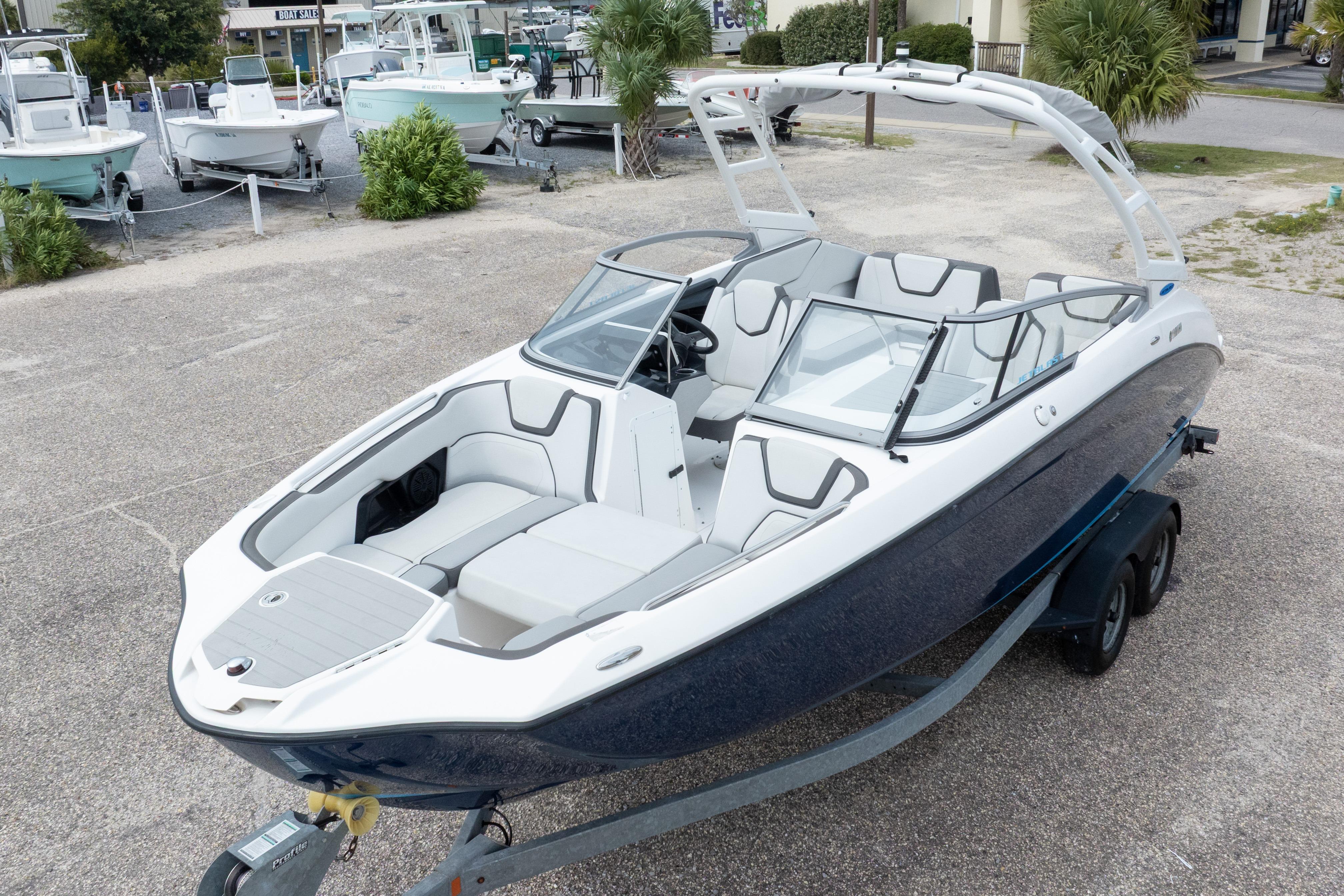 2021 Yamaha Boats AR250 on trailer, sleek design, spacious seating, ready for adventure.