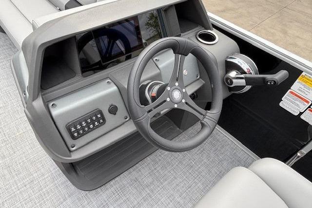 2026 Sun Tracker Party Barge 20 DLX steering console with modern controls and sleek design.