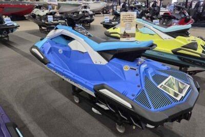 2026 Yamaha WaveRunner JetBlaster DLX 3-Up in blue on display at a showroom.