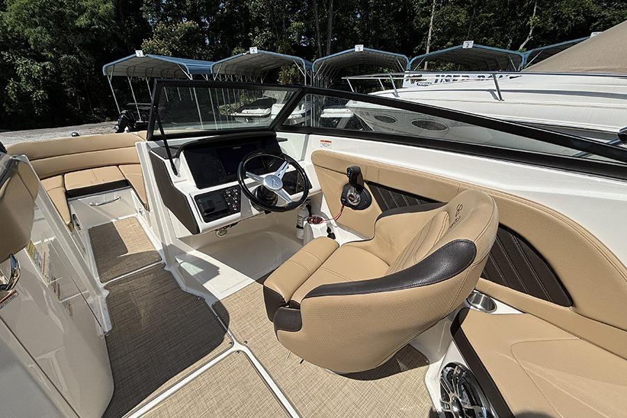 2019 Sea Ray SPX 230 Outboard boat interior with tan seating and modern dashboard.