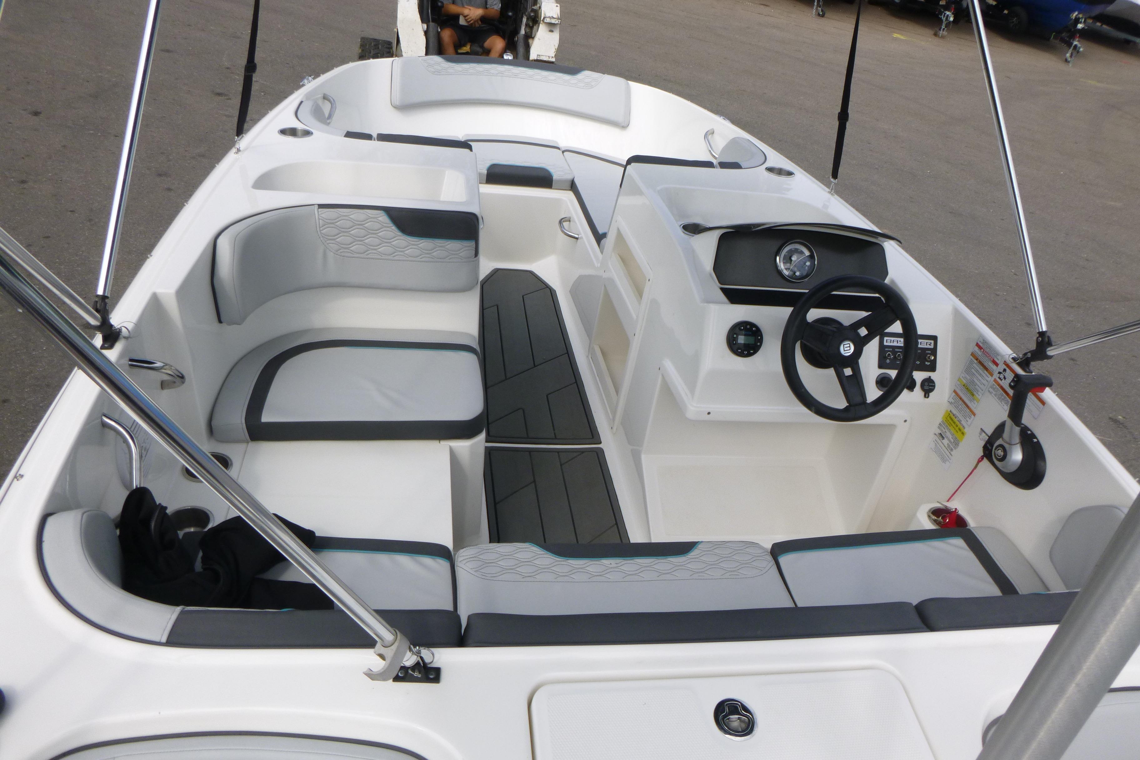 2022 Bayliner Element M17 boat interior with seating and steering console.