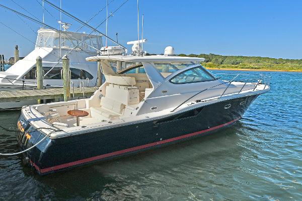 2008 Tiara Yachts 4200 Open docked in a serene marina setting.