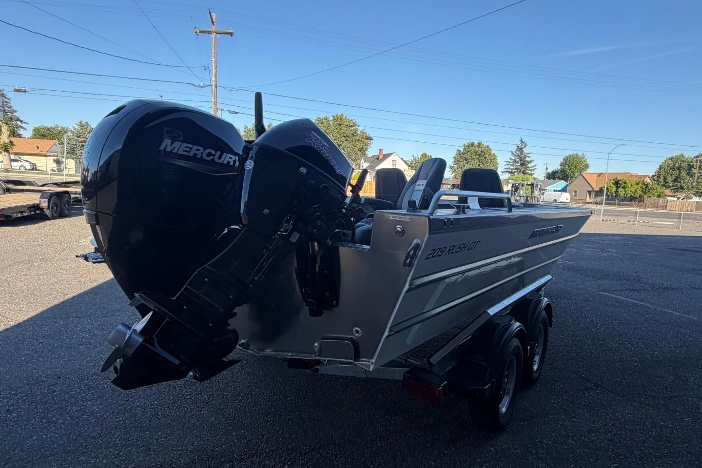 2026 Thunder Jet 209 Rush OT boat with Mercury engine, parked on a trailer.