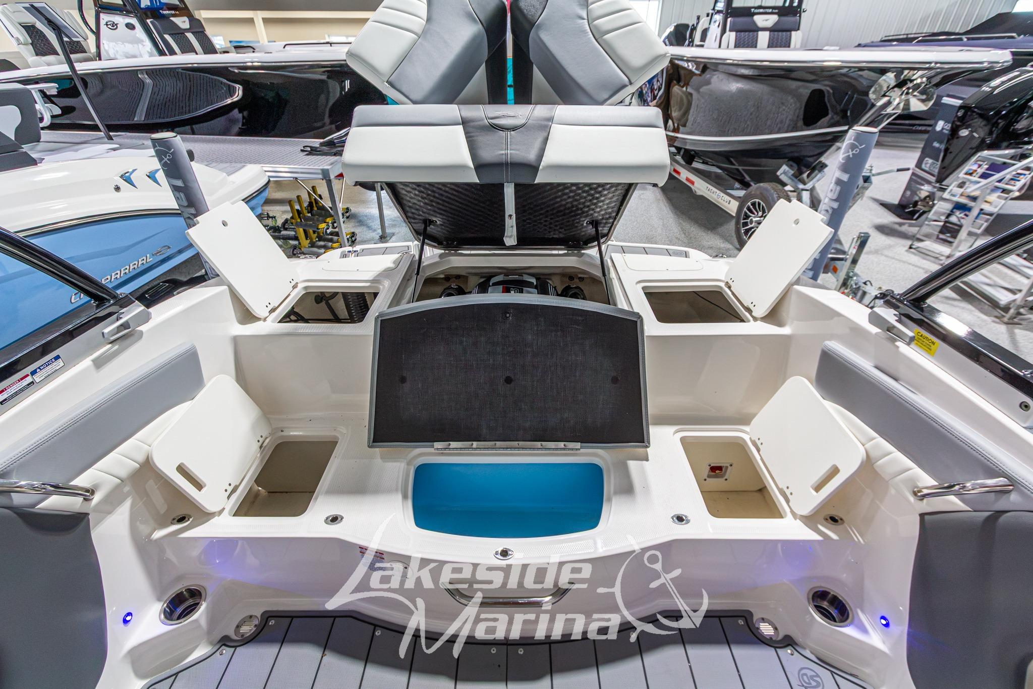 2022 Chaparral 21 SSi boat interior with open storage compartments at Lakeside Marina.