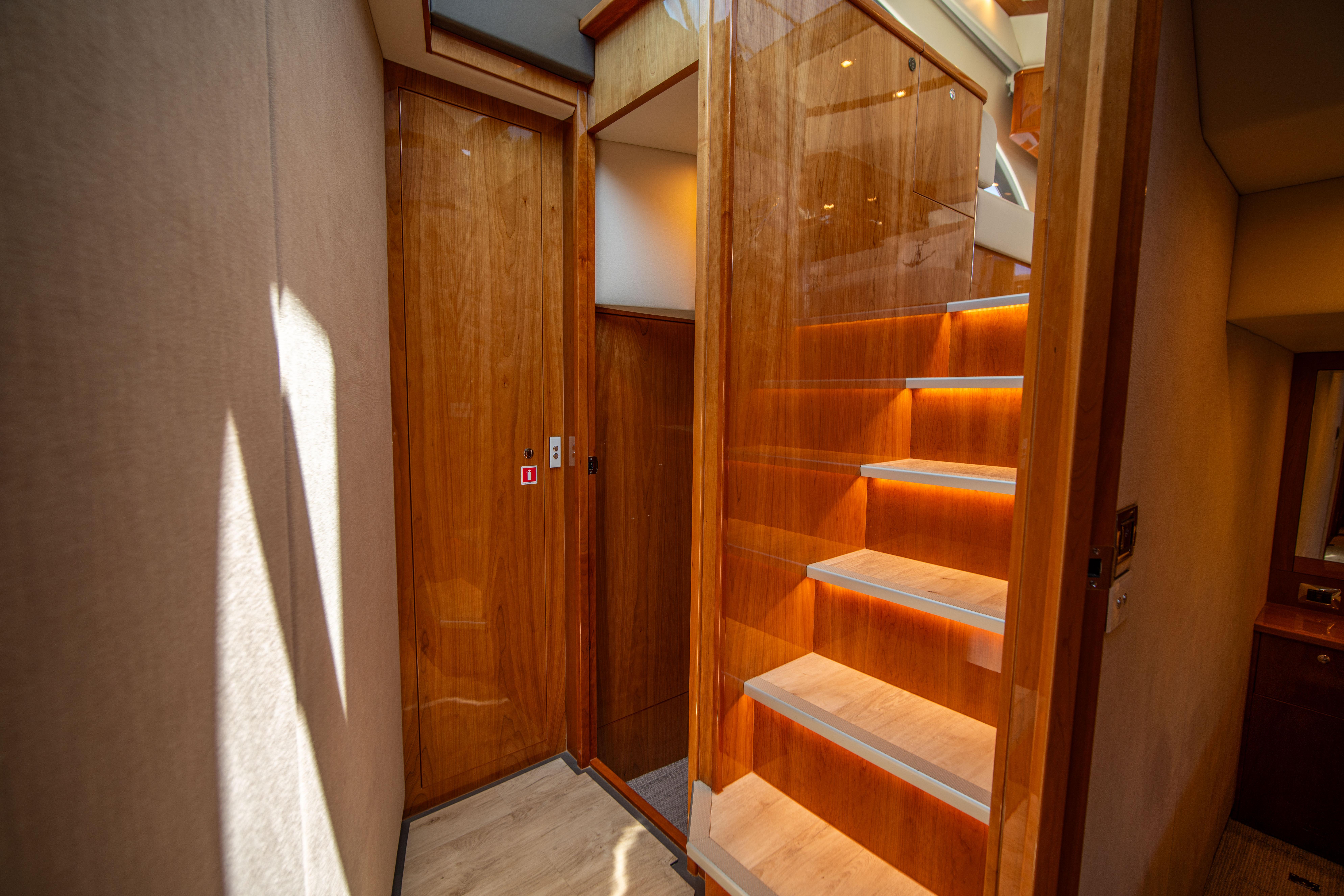 Interior of 2020 Riviera 525 SUV with wooden stairs and modern design.