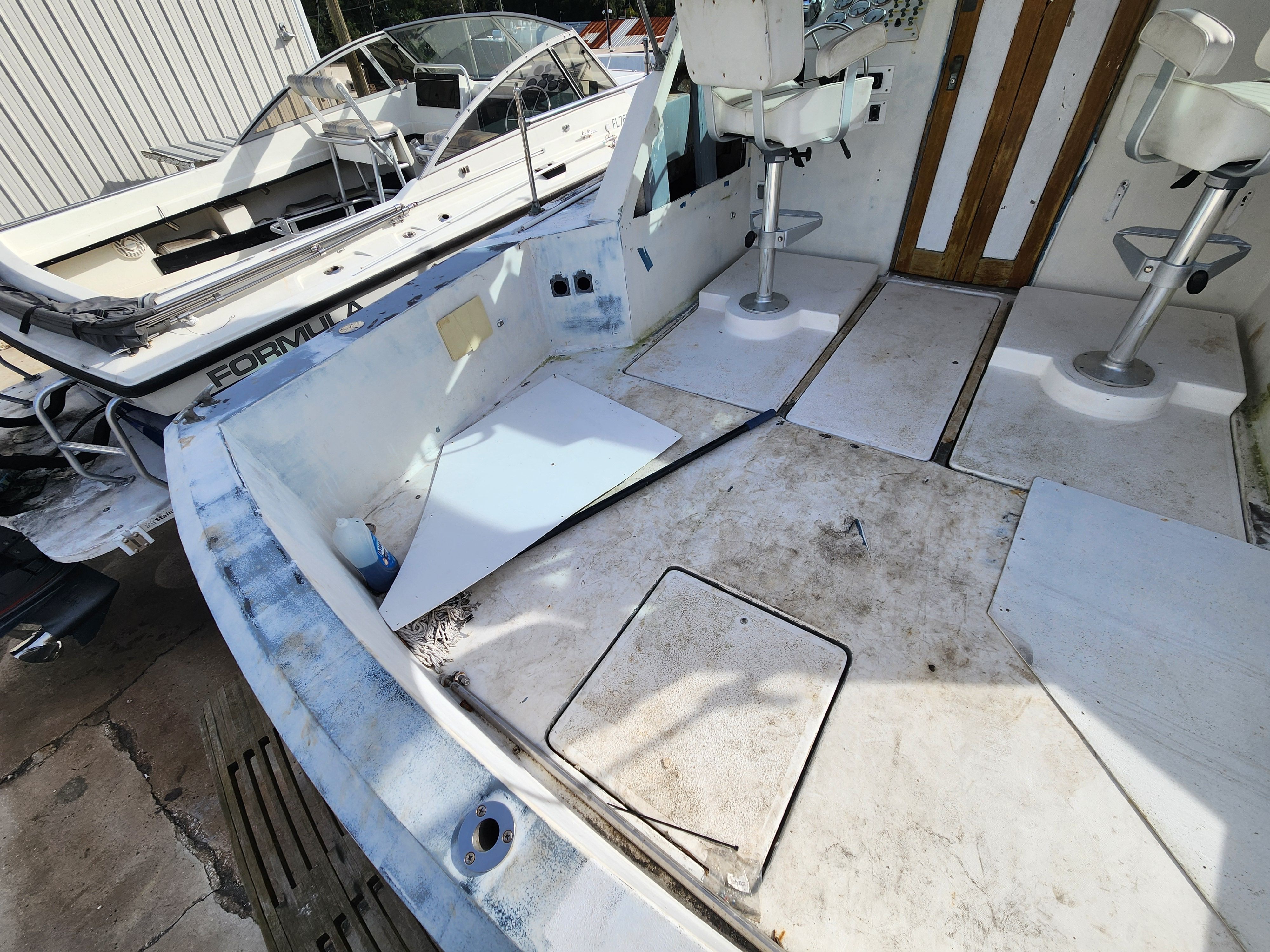 Interior of a 1967 Hatteras 28ft boat, showing wear.
