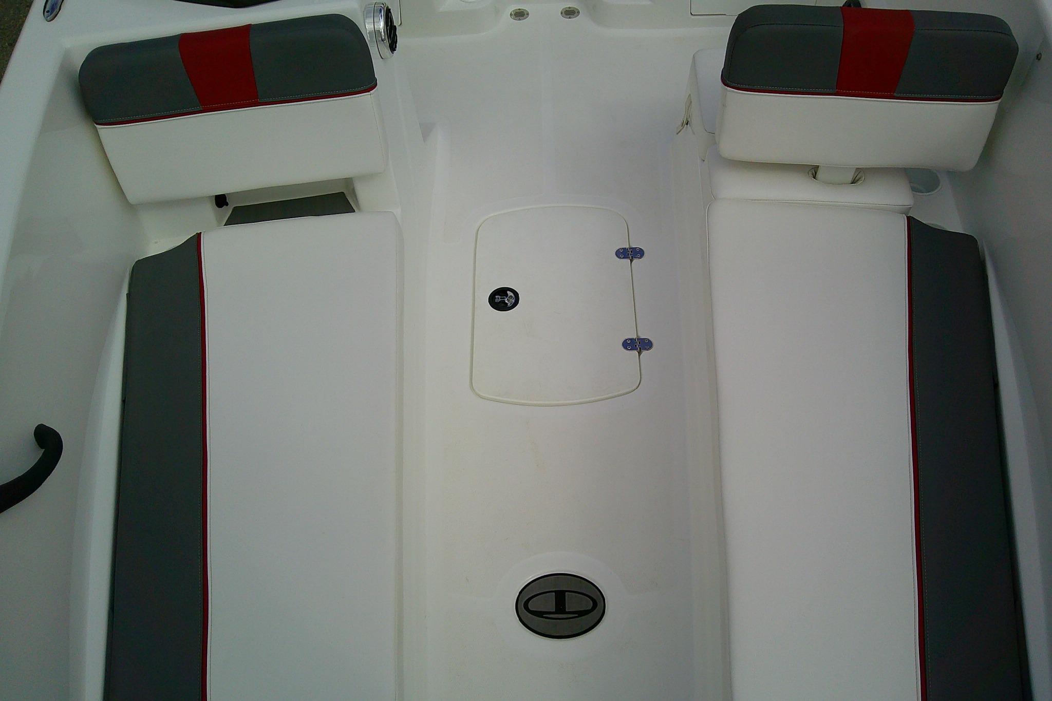 2024 Tahoe T18 boat interior with white and gray seating, featuring red accents.