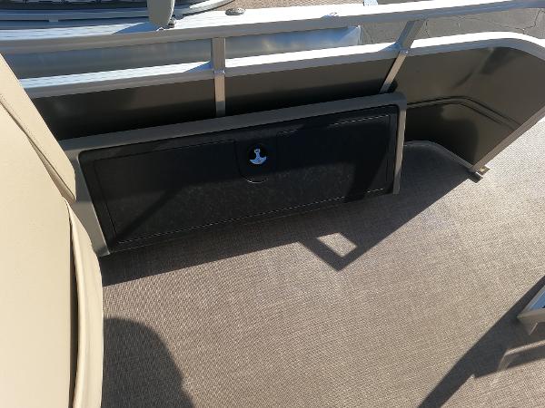 2024 Sun Tracker Fishin' Barge 22 XP3 interior storage compartment.