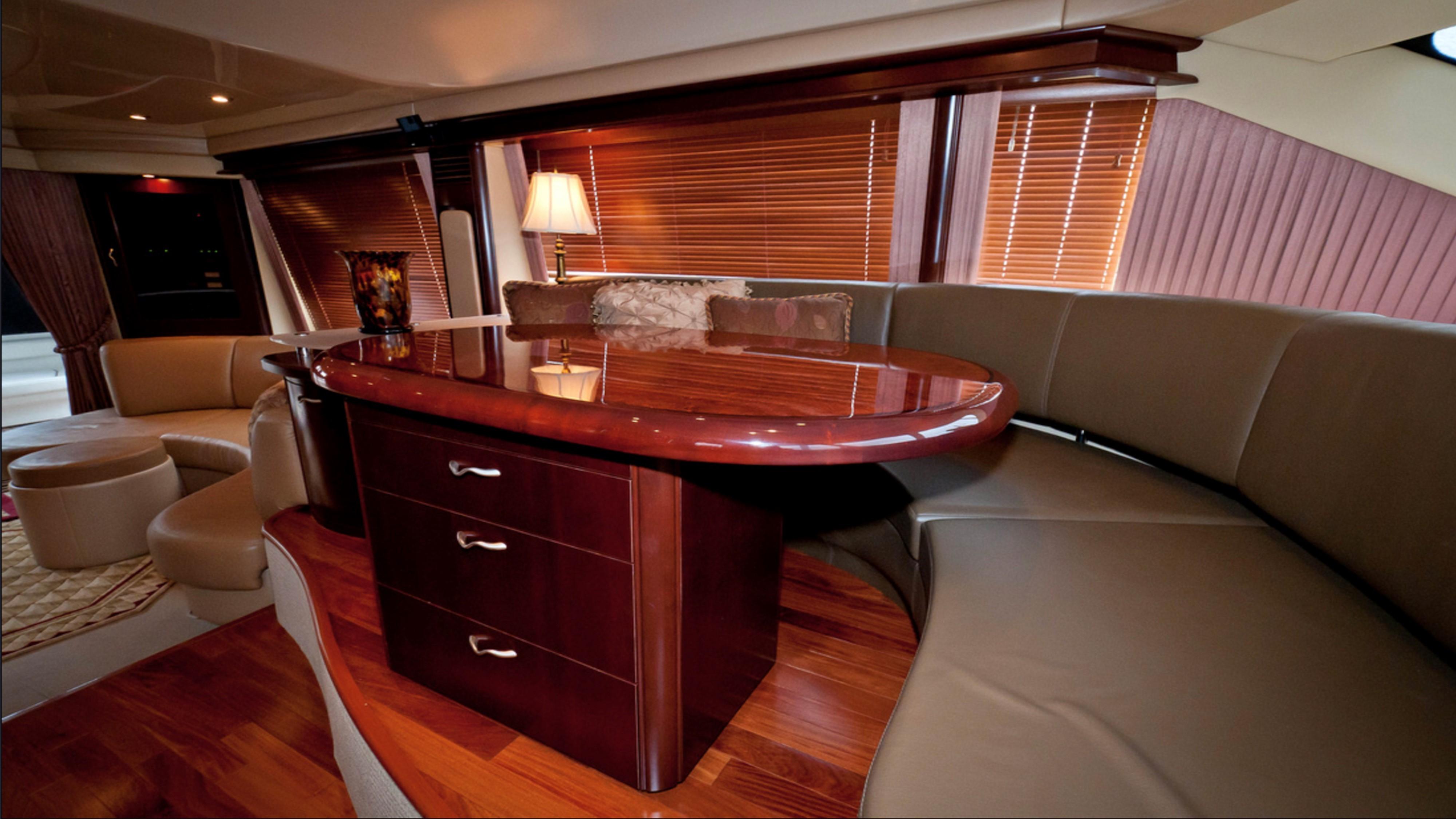 Luxurious interior of 2006 Sea Ray 58 Sedan Bridge yacht with elegant wood finishes.