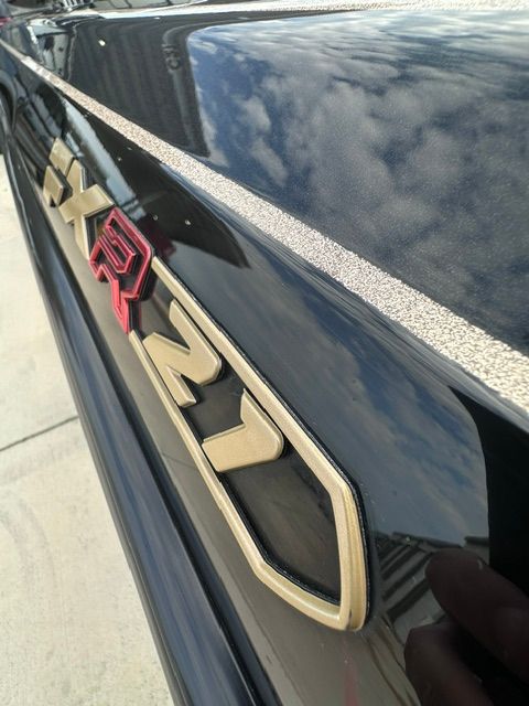 Close-up of the "FXR21" lettering on a black boat.