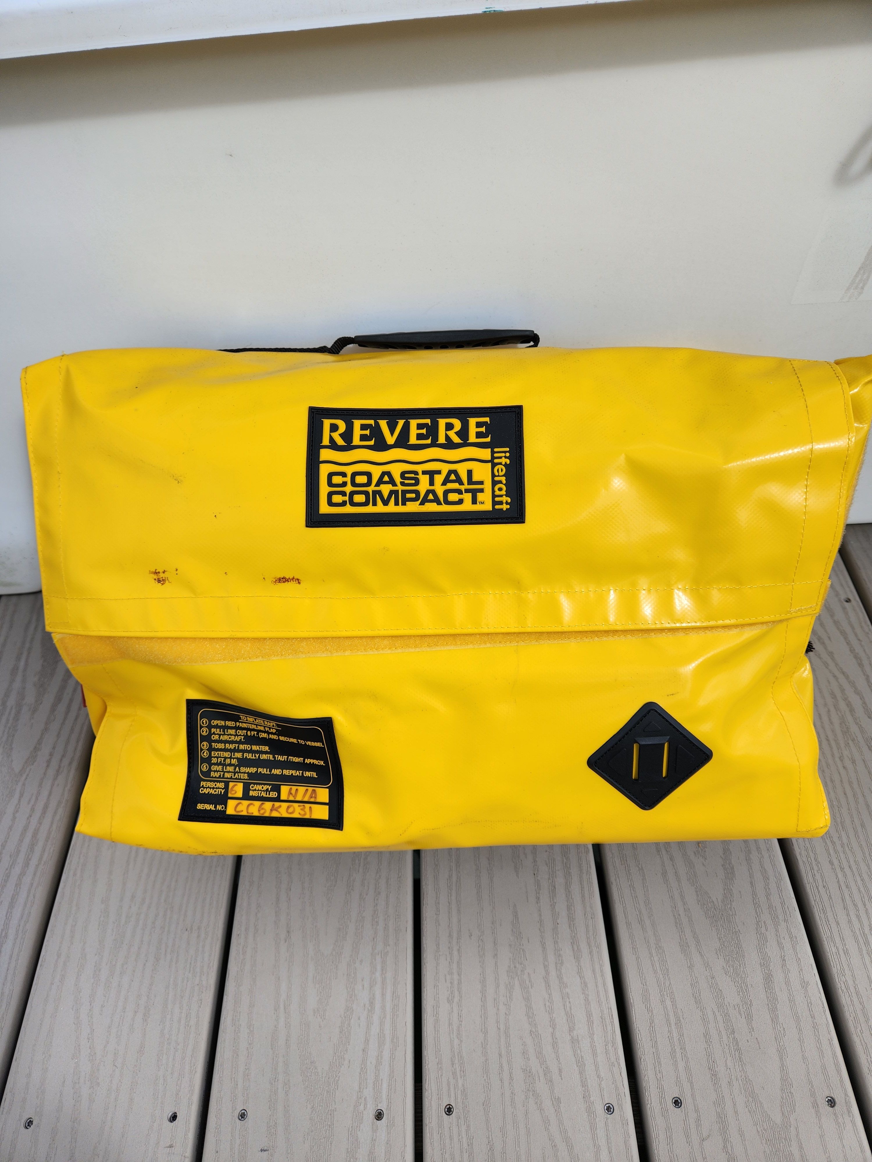 Yellow Revere Coastal Compact life raft on a boat.