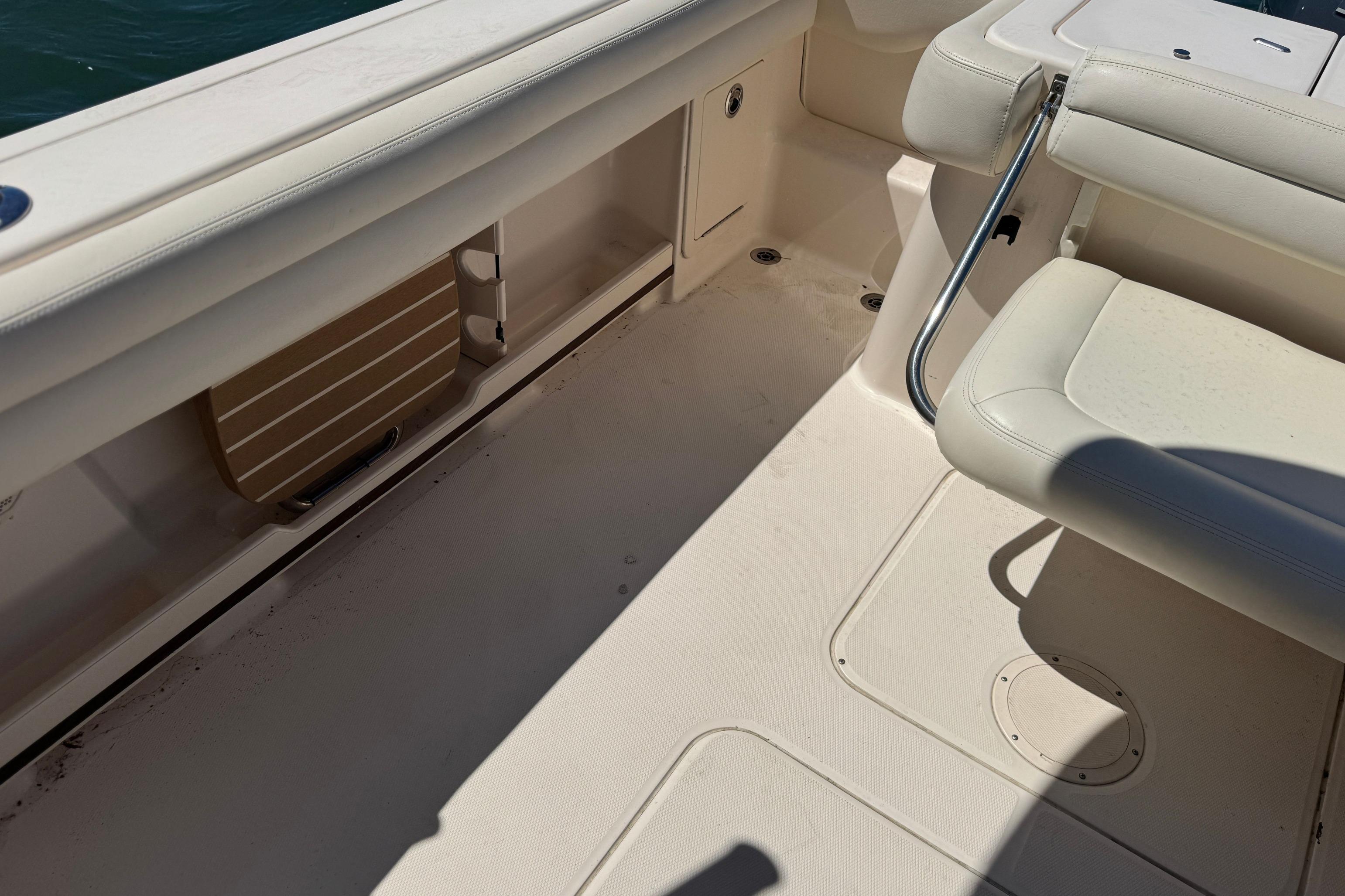 2017 Grady-White Freedom 235 boat interior with seating and storage compartments.