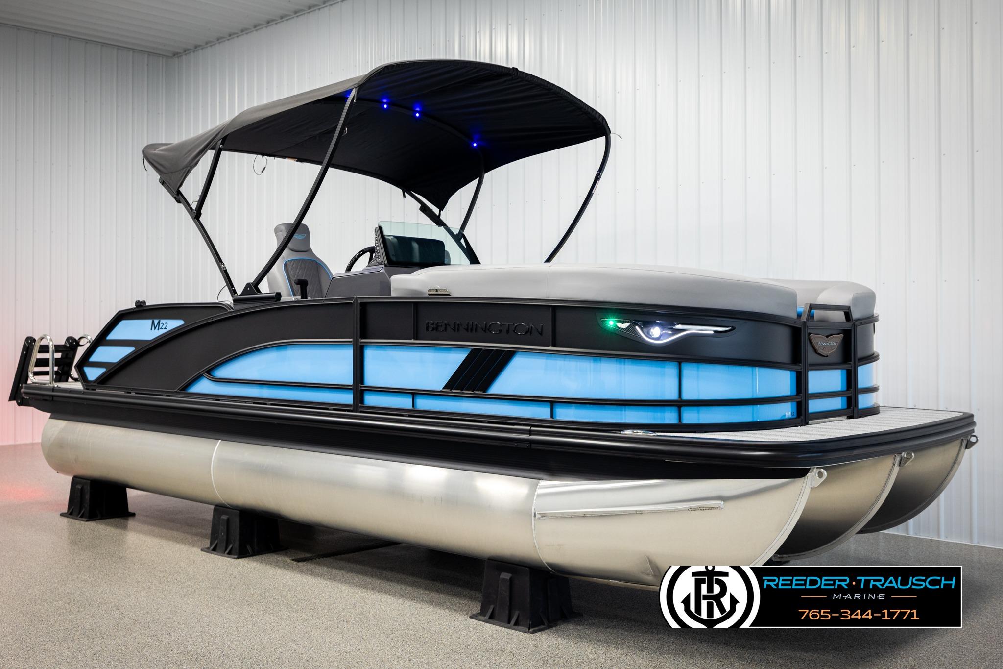 2026 Bennington 22 MSBSE pontoon boat with canopy in showroom.