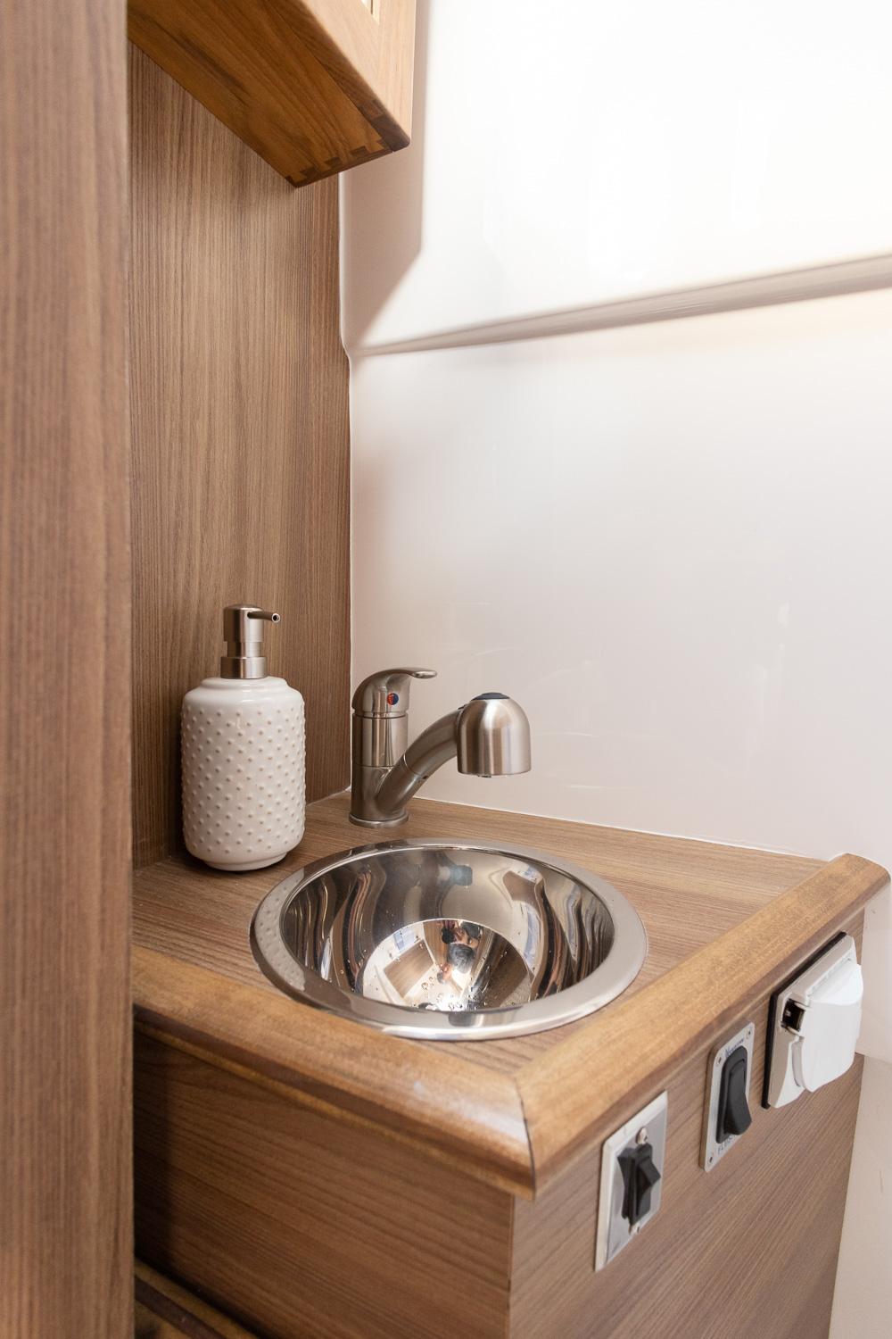 Compact sink area in 2025 Solara S-310 CW with modern fixtures.