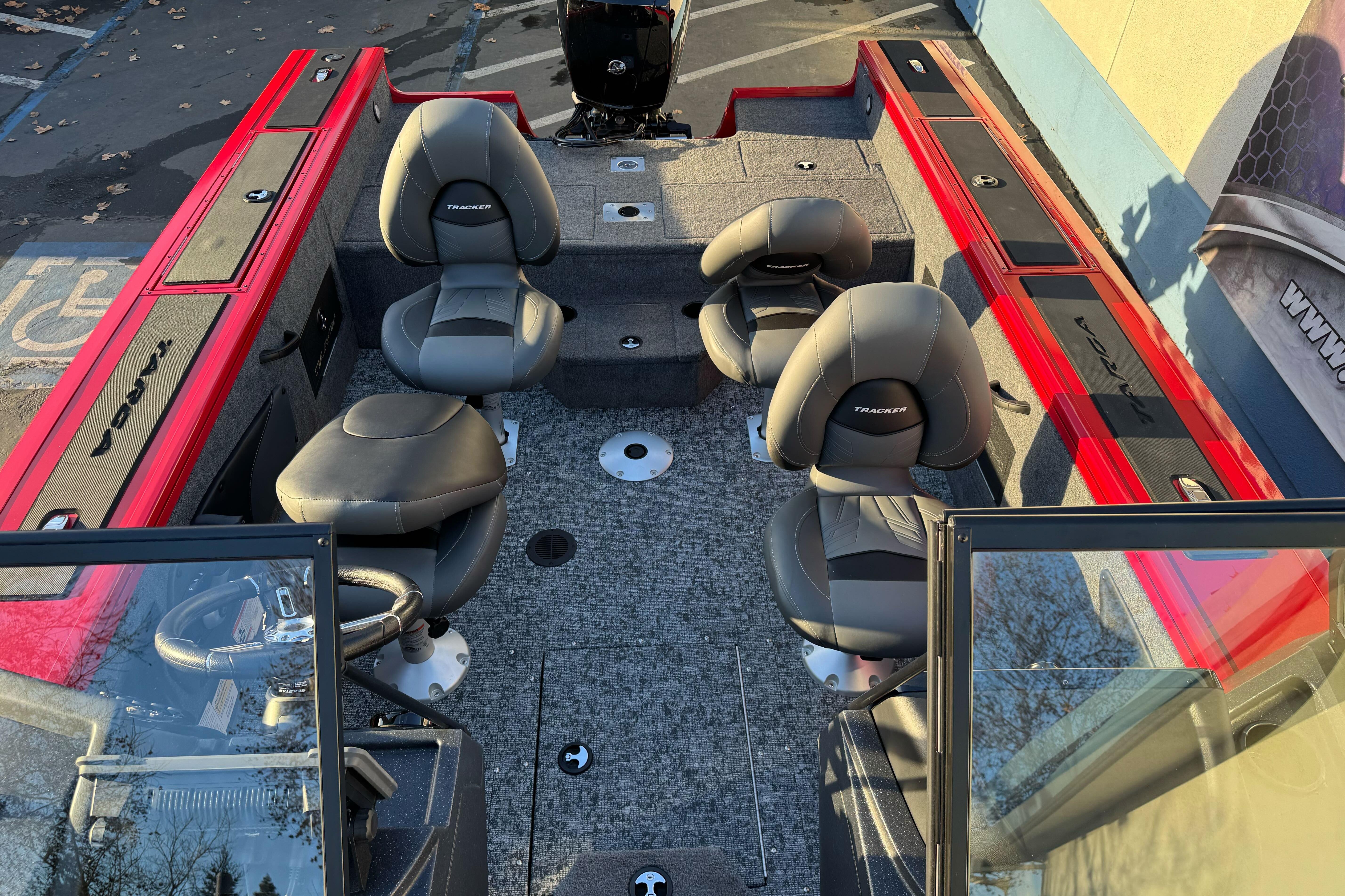 2026 Tracker Targa V-18 WT boat interior with four seats and red accents.