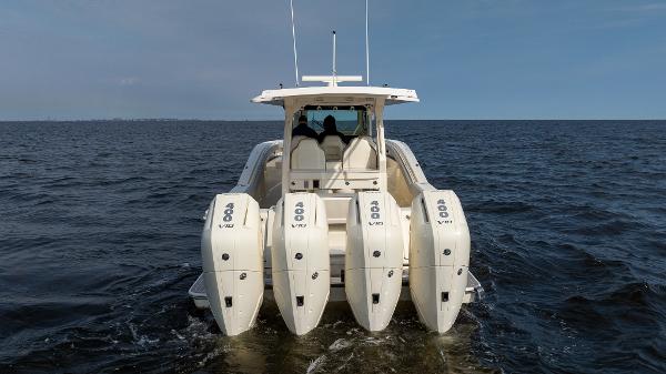2025 Scout 425 LXF boat with four powerful outboard engines on open water.