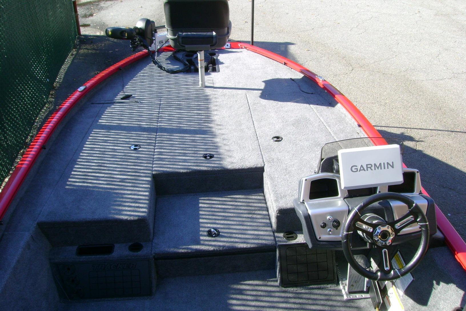 2026 Tracker Savage 215 boat interior with Garmin navigation system and steering wheel.
