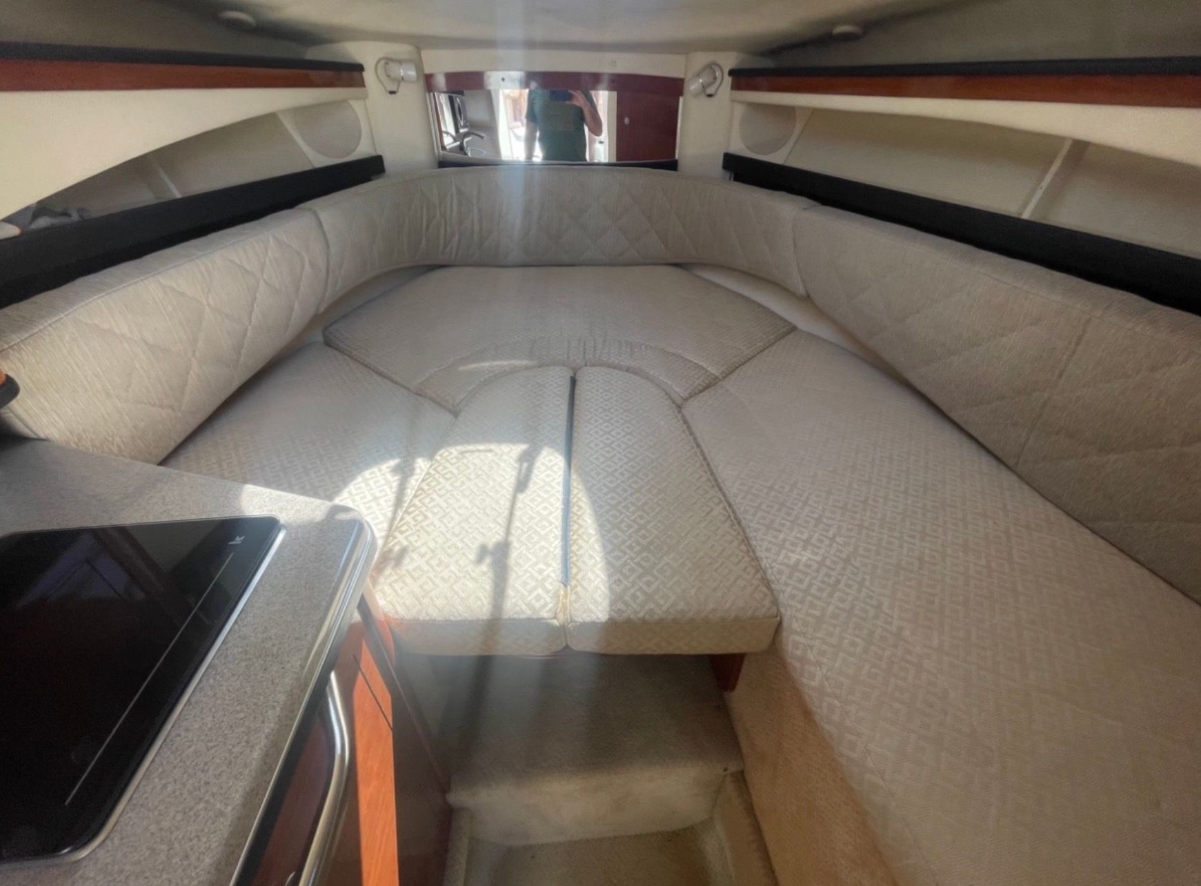 Interior of 2006 Sea Ray 270 Amberjack with cozy sleeping cabin.