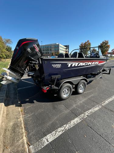 2025 Tracker Targa V-19 WT boat on trailer in parking lot, sunny day.