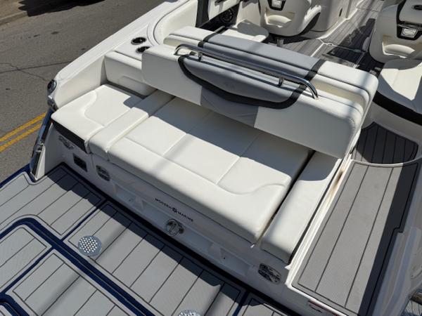 2023 Chaparral 267 SSX boat interior with white seating and sleek design.